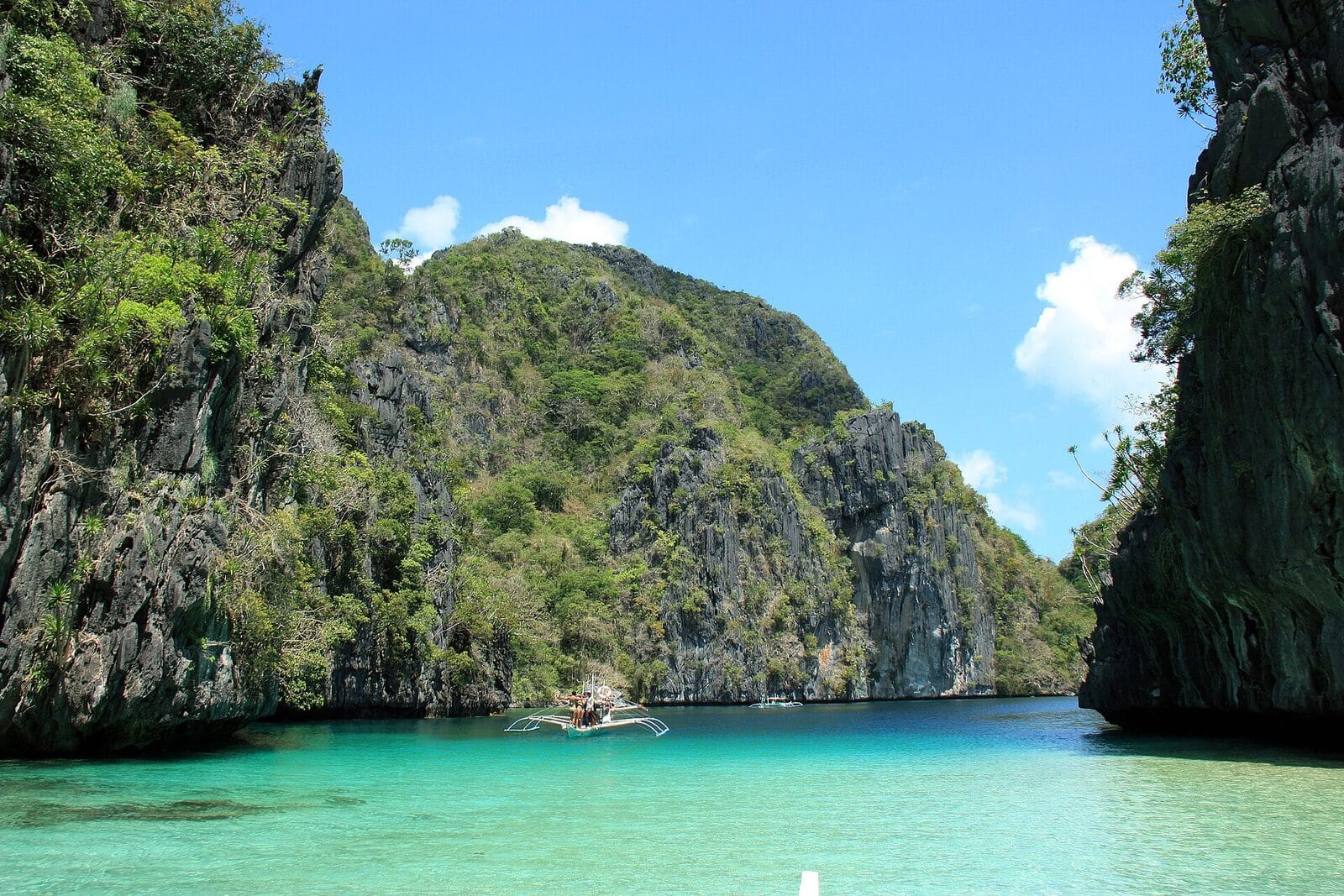 A boat in the emerald Big Lagoon at El Nido, Palawan