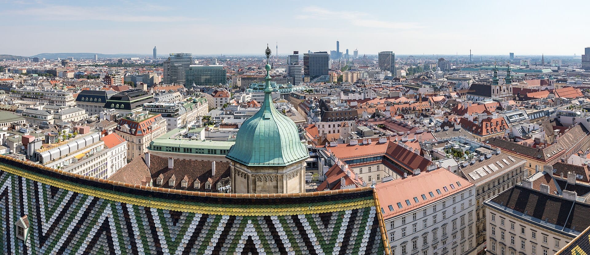 Vienna's rooftops seen from St Stephen's Cathedral, with the Peterskirche dome rising over the old town