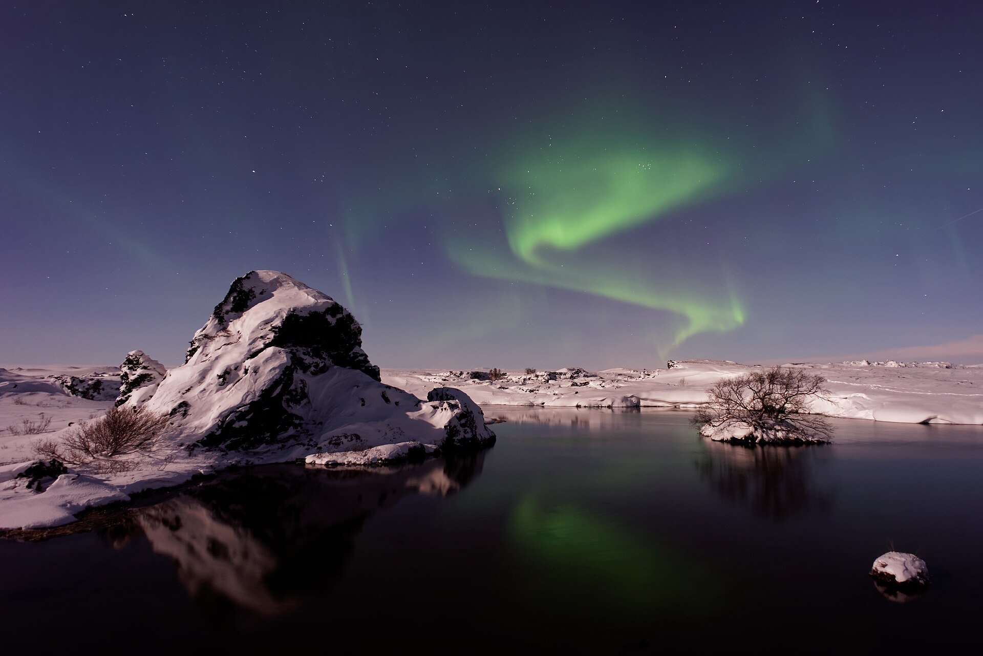 Northern lights snowmobiling, Iceland
